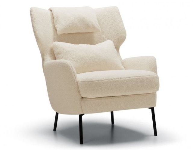 SITS Alex Armchair featuring curved lines and slender legs, photographed in cream fabric